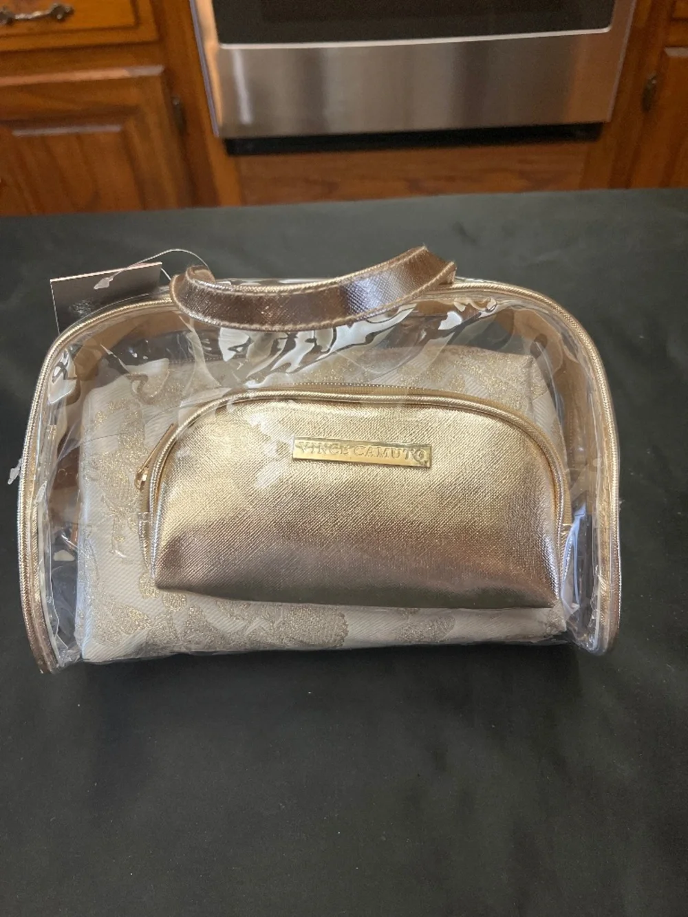 NWT Vince Camuto Clear PVC/Floral/Gold 3 Piece Make /Up bag Set.